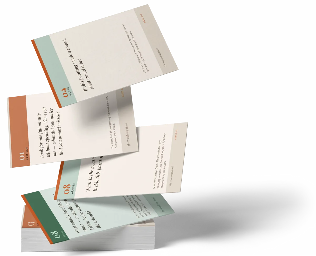 A scatter of Wondering Hand Conversation Starter cards, each numbered and printed with a question to ask in front of a painting.
